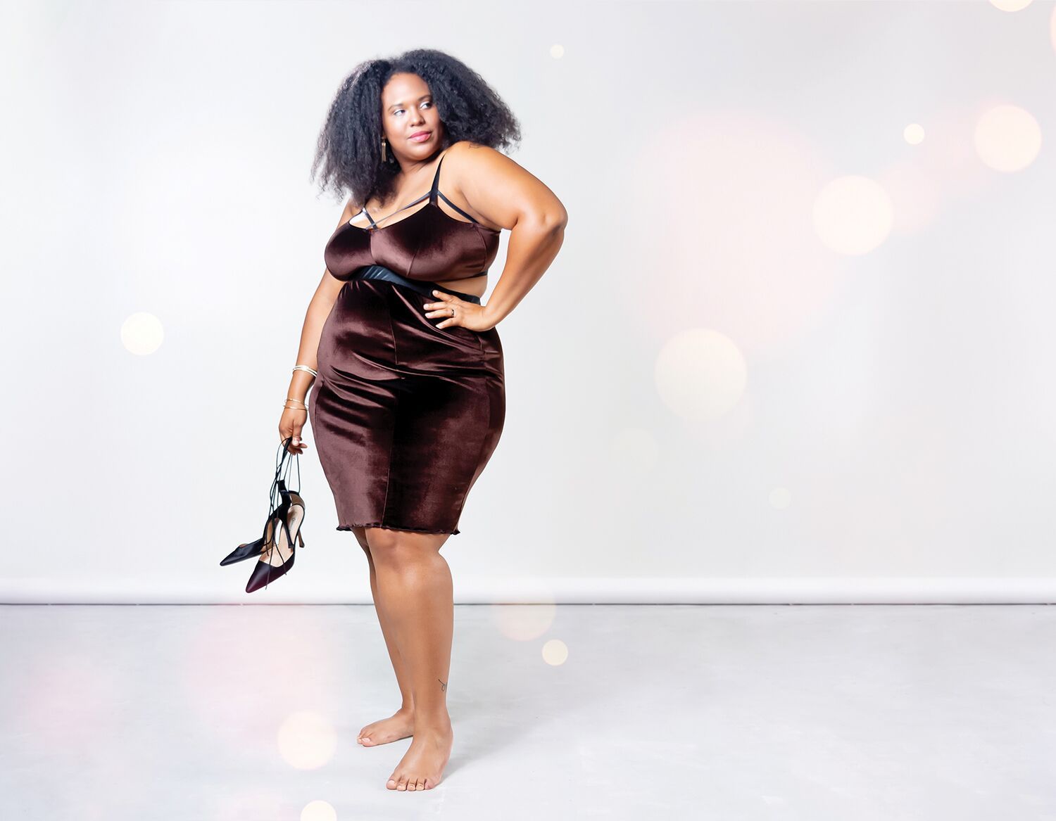 Plus size woman of color modeling Impish Lee
