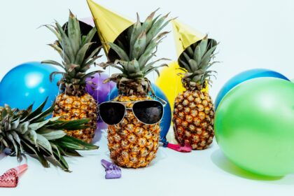 photo of three pineapples surrounded by balloons 1071882 scaled 1