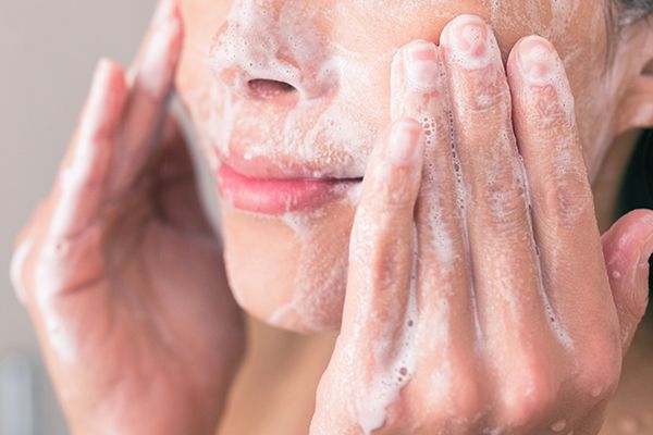 close-up-of-woman-cleansing-her-skin.-skin-care