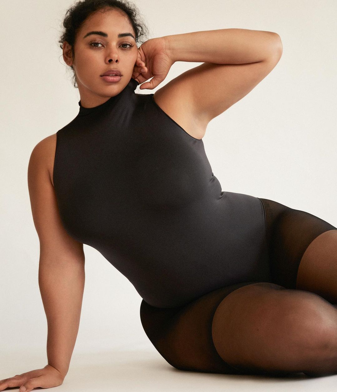 tabria majors in a bodysuit, no makeup, makeup.