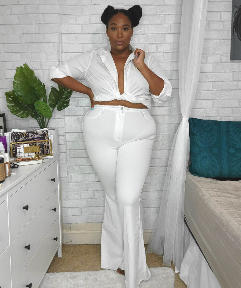Plus size white jeans with white button down top 