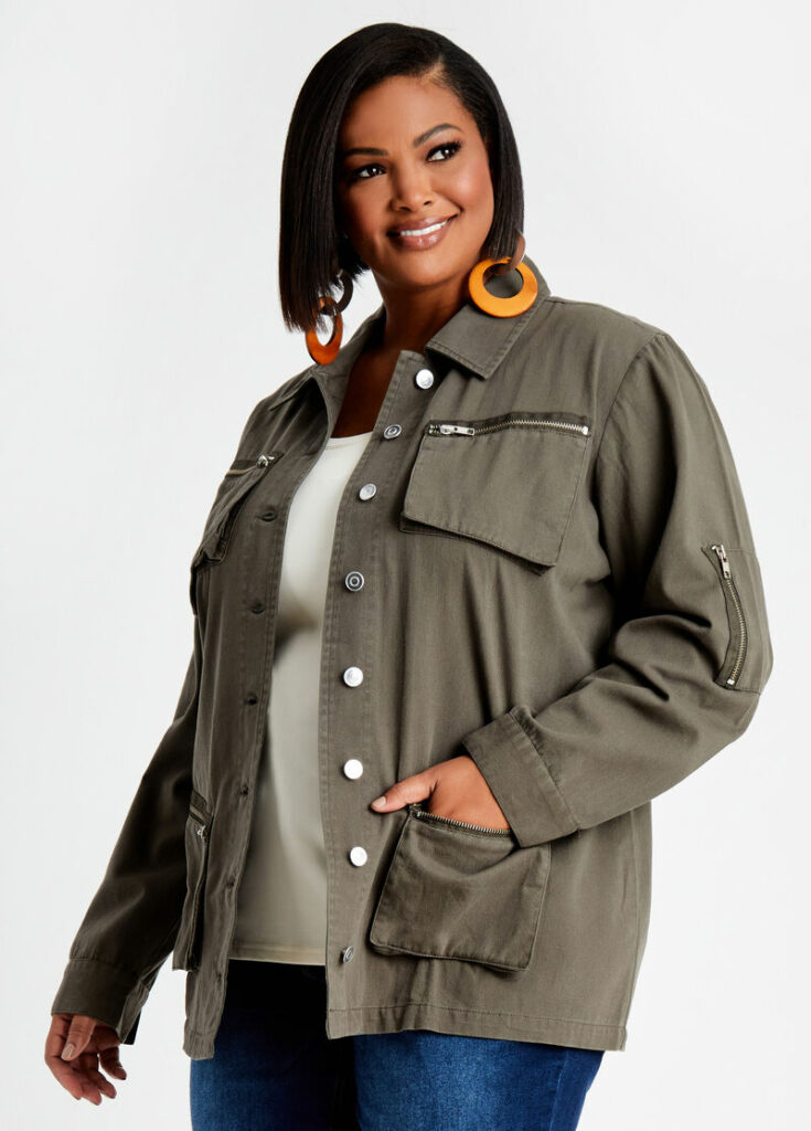 Woman wearing gray utility jackets with zip detail
