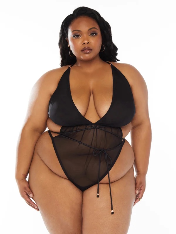 pictured is a plus size woman wearing a mesh teddy