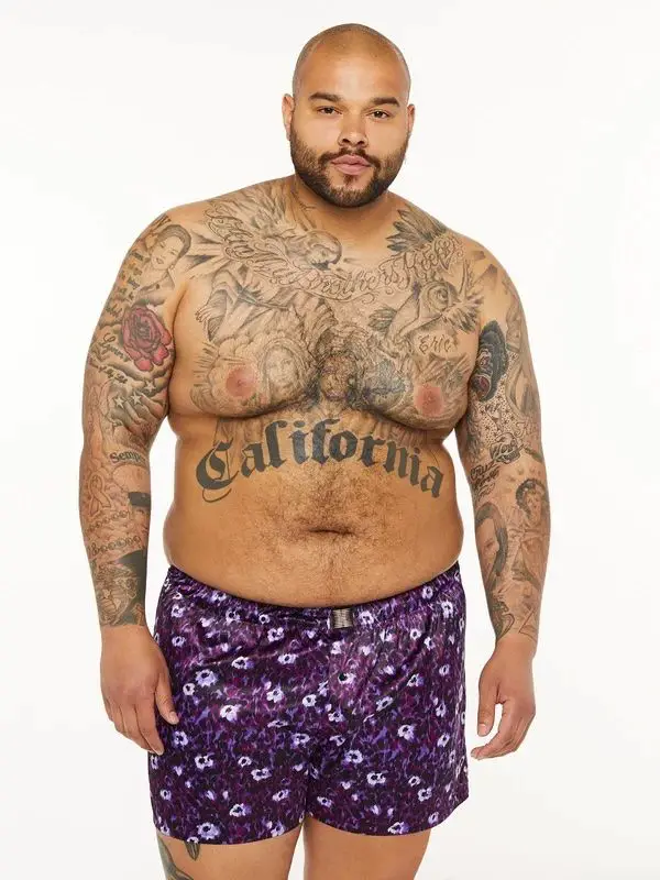 a plus size man wearing silk boxer shorts 