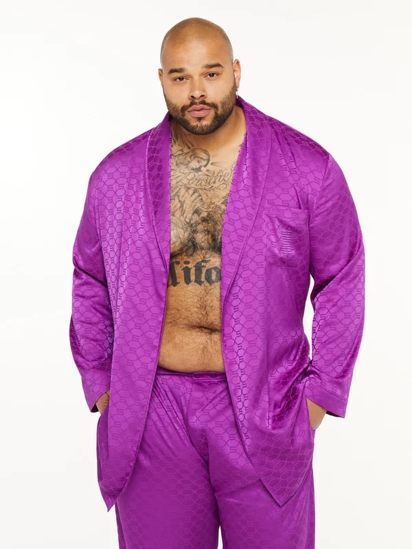 a man in a purple silk pajama set 