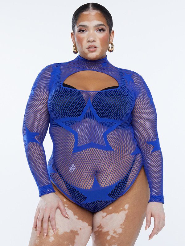 a plus size woman in a star-printed fishnet bodysuit