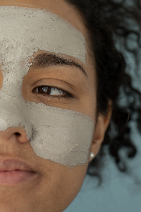 Content black woman in clay mask