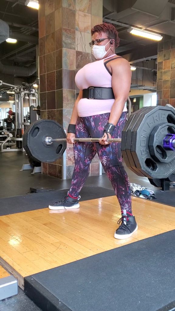 Plus size woman power lifting