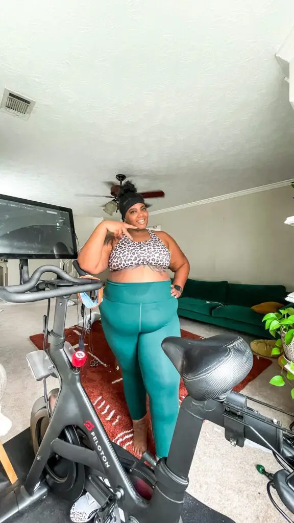 Woman Plus Size in Gym Doing Exercises with Training Apparatus