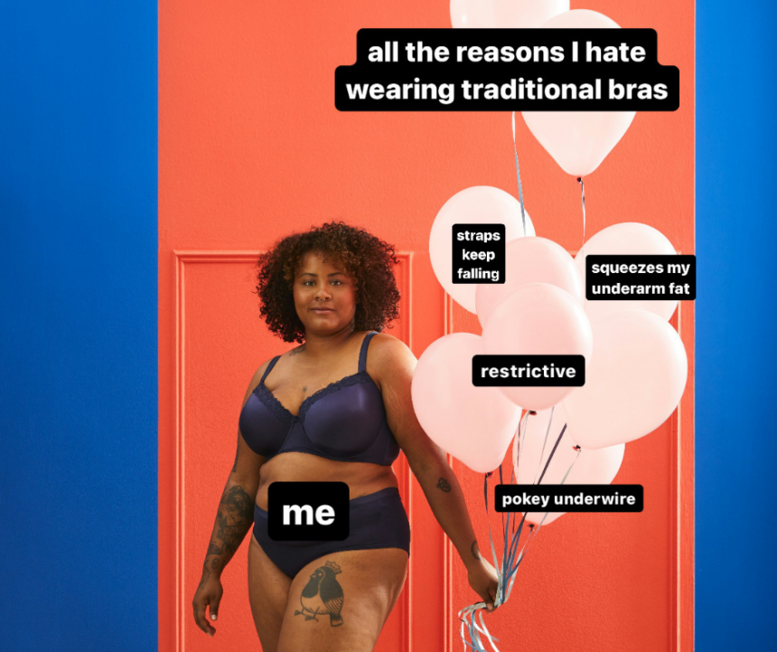brown-skinned plus size woman in traditional underwire bra holding balloons in front of red door looking into camera holding balloons representing reasons people hate bras