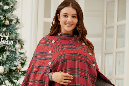 white woman smiling in red and green plaid cape