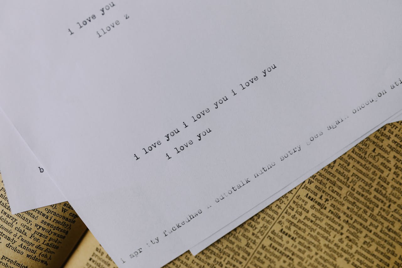 Photo by KoolShooters  : https://www.pexels.com/photo/a-bond-paper-with-i-love-you-text-6980694/