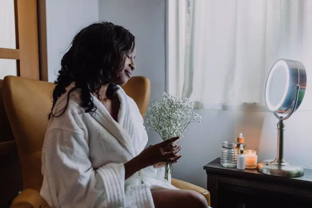 Photo by RDNE Stock project: https://www.pexels.com/photo/a-woman-wearing-white-robe-holding-a-bunch-of-baby-s-breath-flowers-6724541/