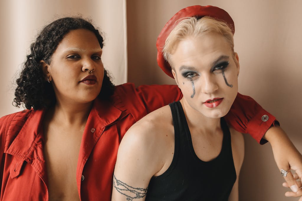 A striking portrait of two stylish friends with bold makeup, showcasing diversity and fashion in a studio setting.

compliments plus size women want