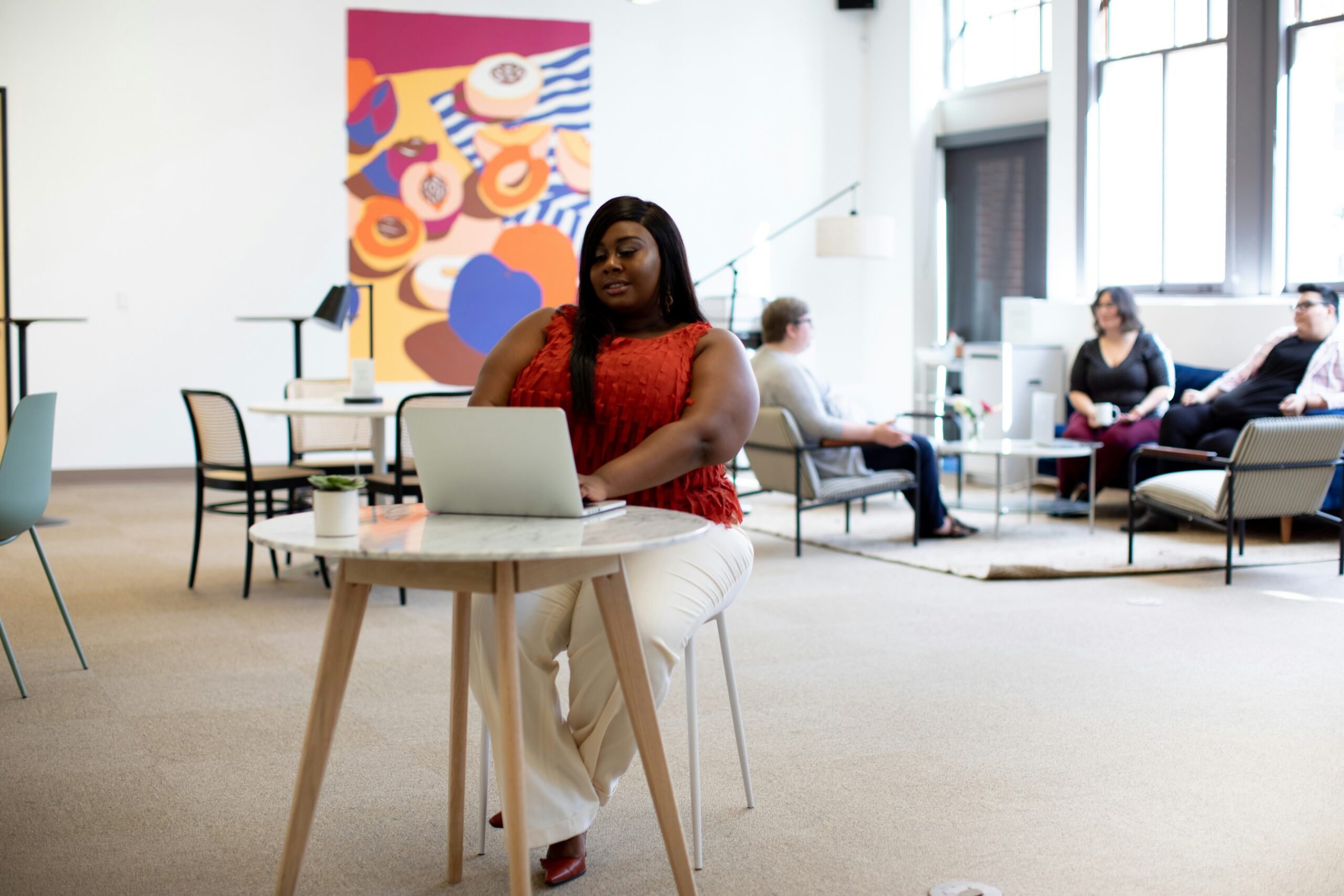 young black women sitting in office chair