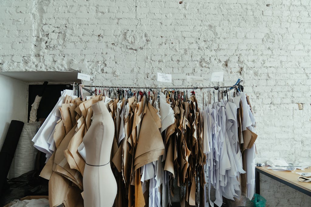 Industrial fashion studio interior with various sewing patterns and mannequins against a brick wall.
plus size style hacks