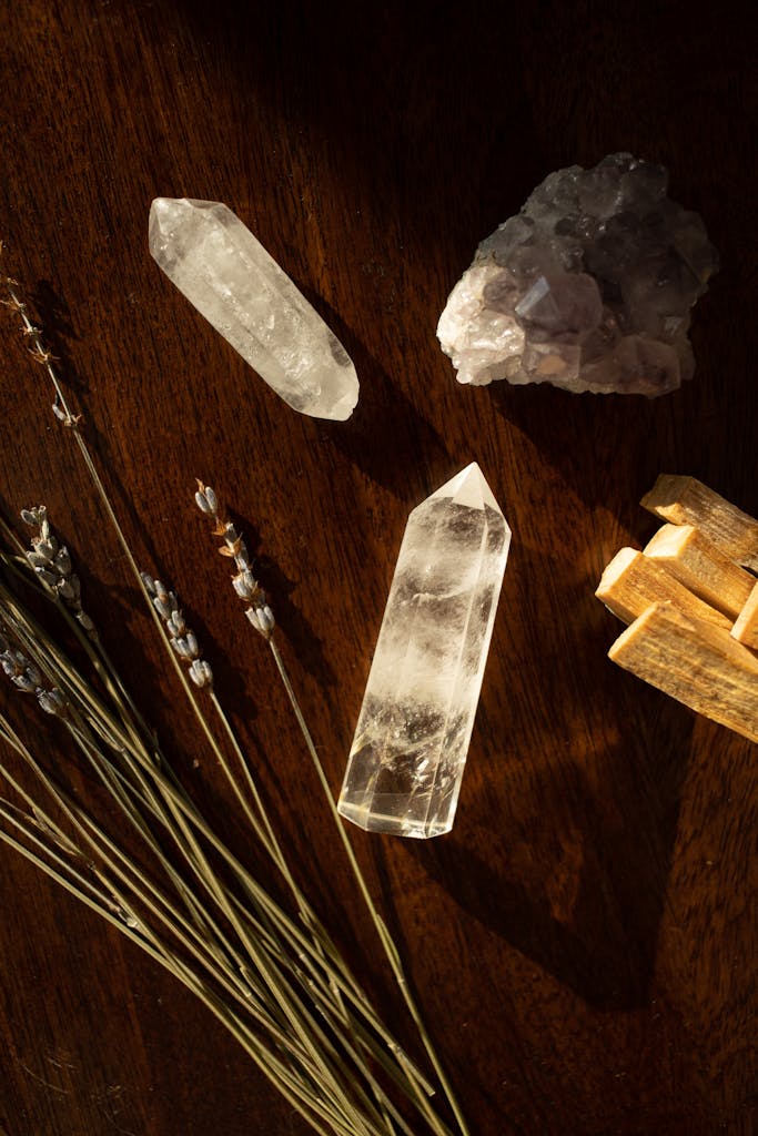 A calming flat lay of crystals, lavender, and palo santo for spiritual rituals.