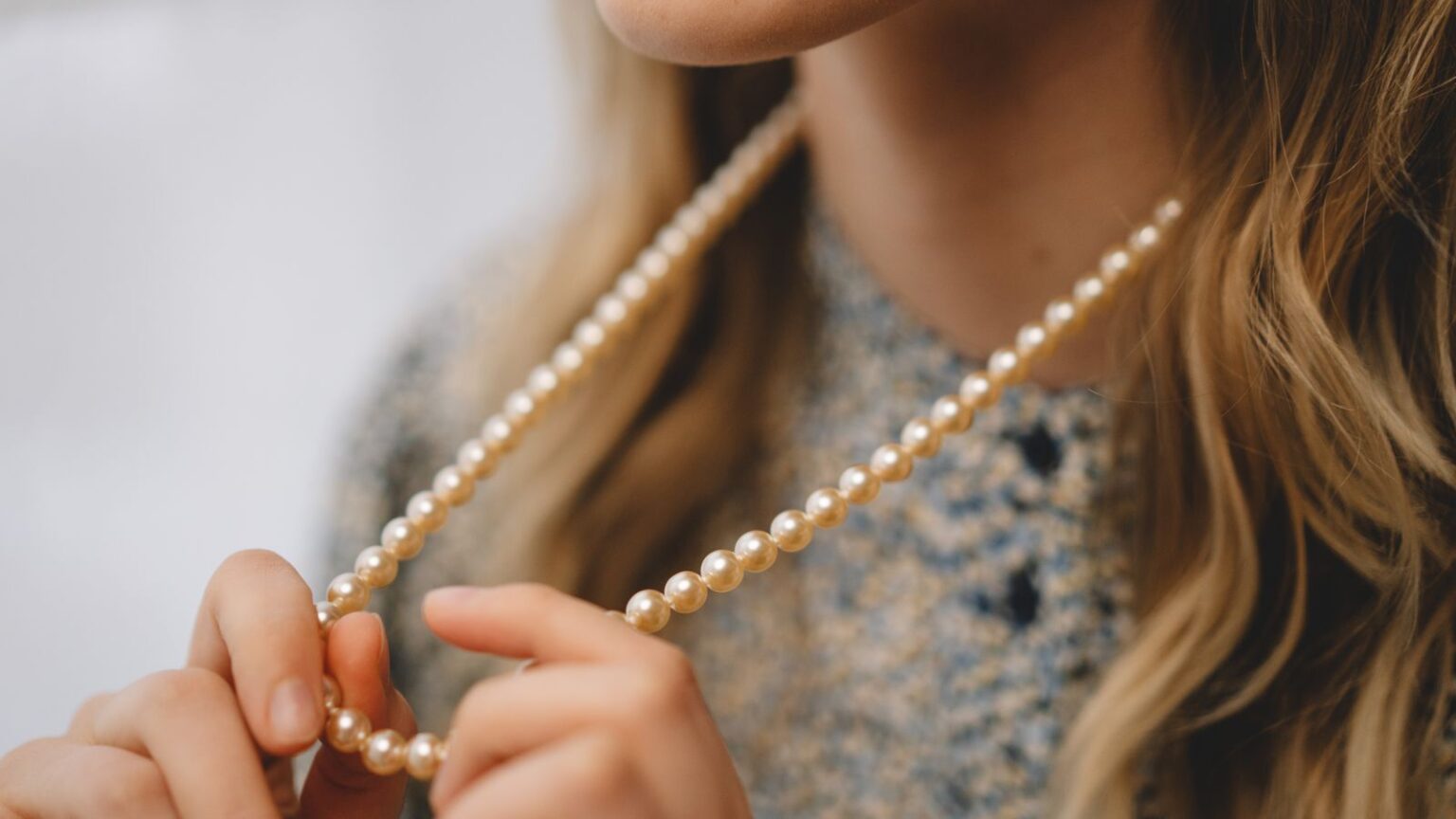 Cardigan and pearl necklace