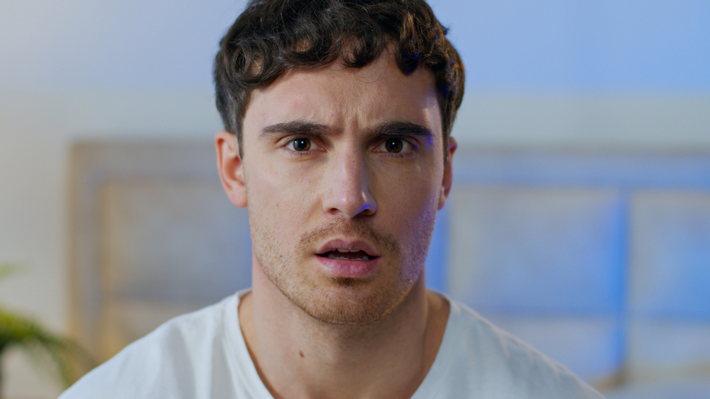 Disgusted confused young Caucasian man