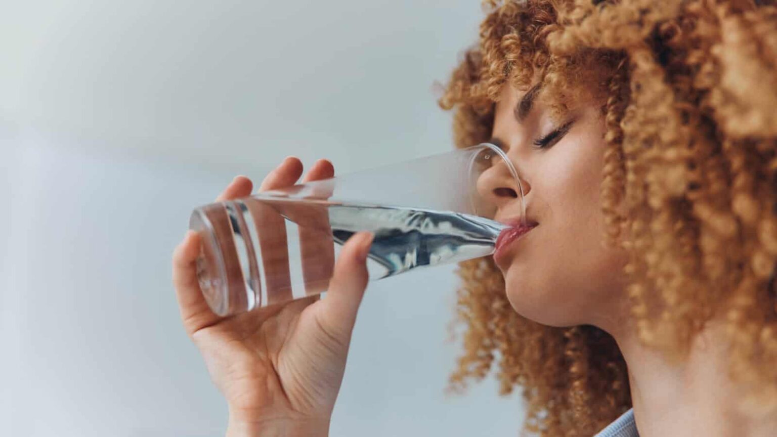 Drinking water. Image credit ShotPrime Studio via Shutterstock