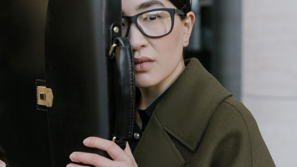 Lady with coat and briefcase