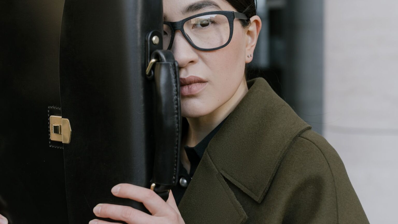 Lady with coat and briefcase
