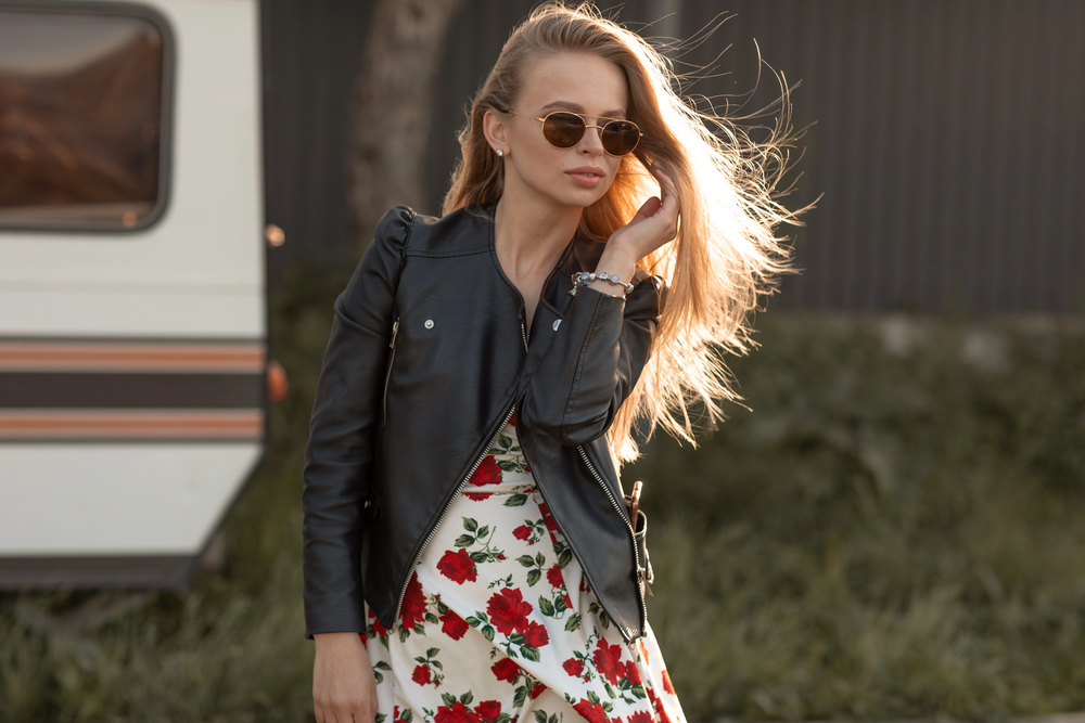 Leather jacket over floral dress