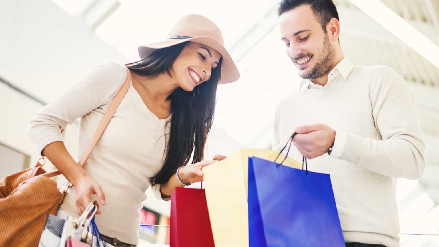 Man and woman shopping. Image credit Ivanko80 via Shutterstock