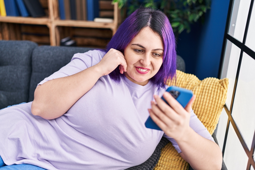 Plus size woman using phone