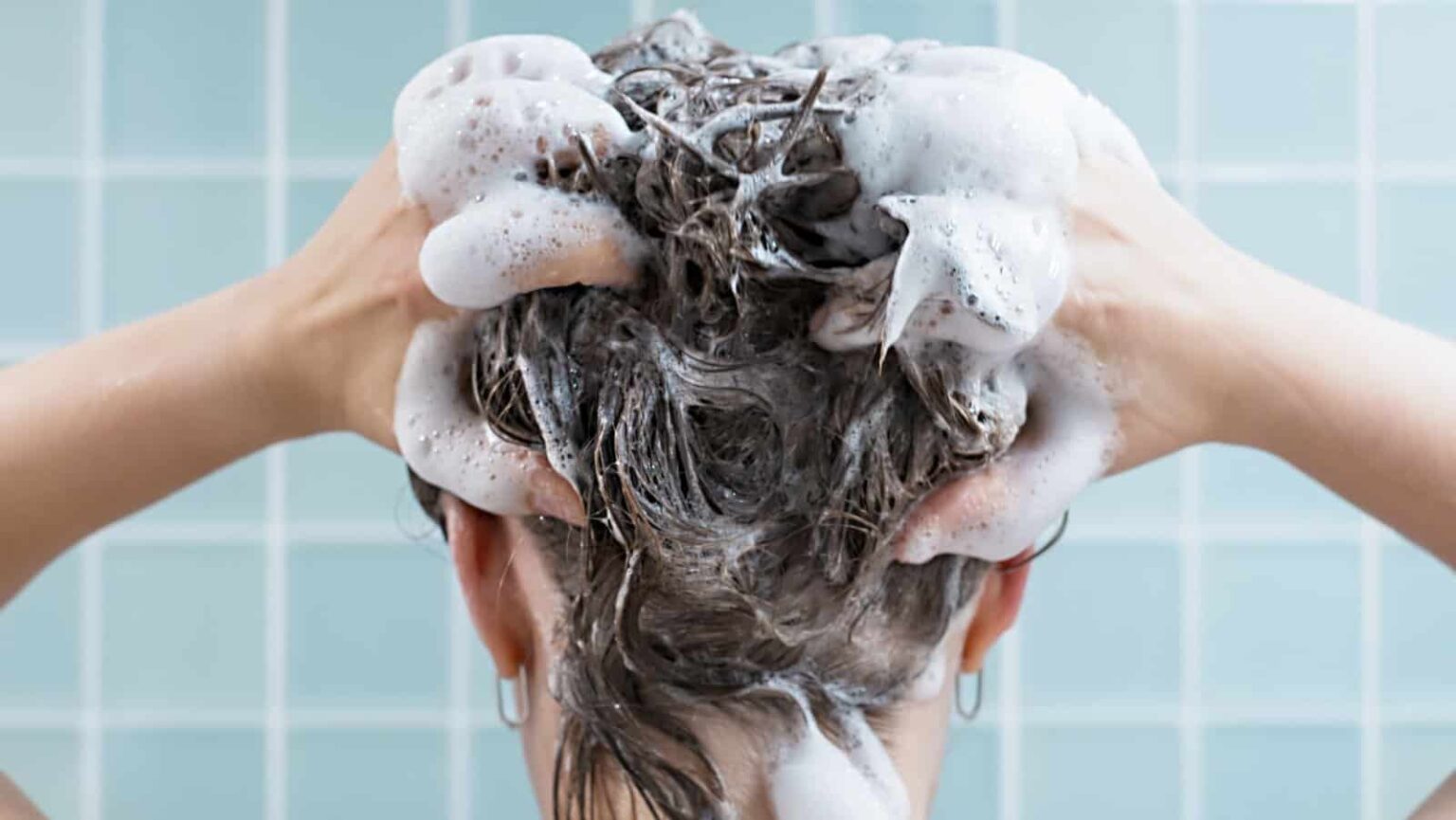 Washing hair. shampoo. TanyaKim via Shutterstock
