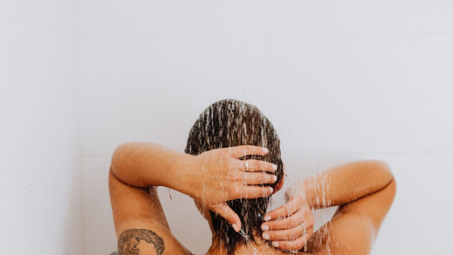 Woman rinsing hair