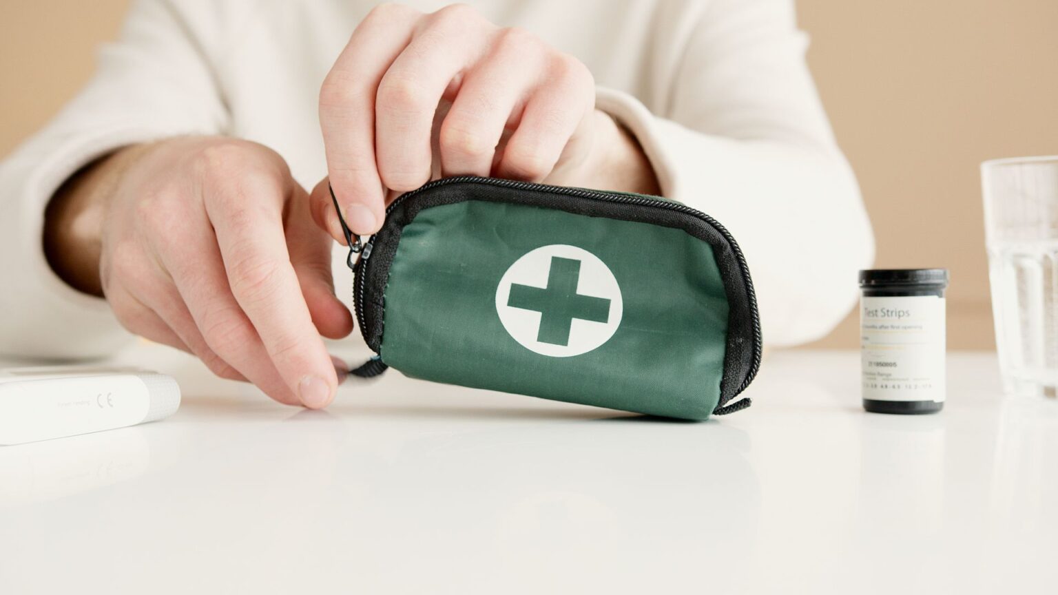 a person holding a green and black pouch 6823511