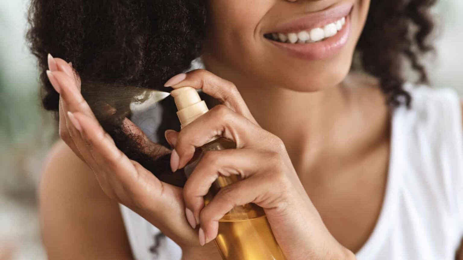 applying hair treatment. Image credit Prostock studio via Shutterstock