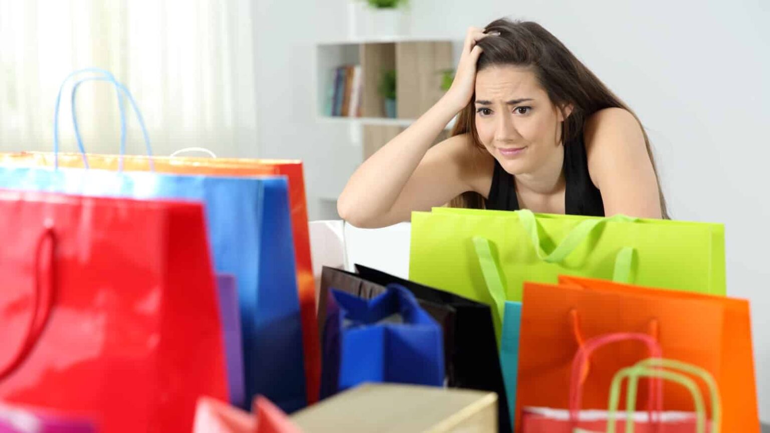 female shopper regretting purchases. Image credit Antonio Guillem via Shutterstock