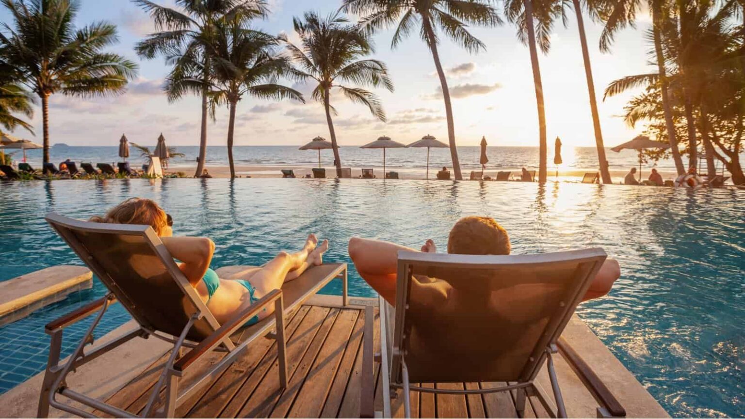 people at pool. Song about summer via Shutterstock