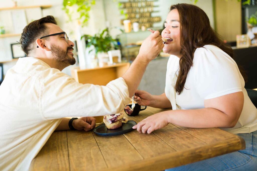 stock photo romantic man feeding dessert his.jpg 1