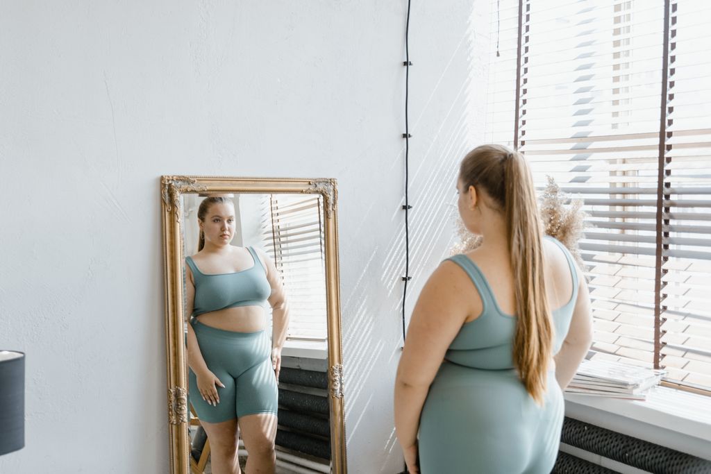 plus size woman reflecting on self-love and personal growth